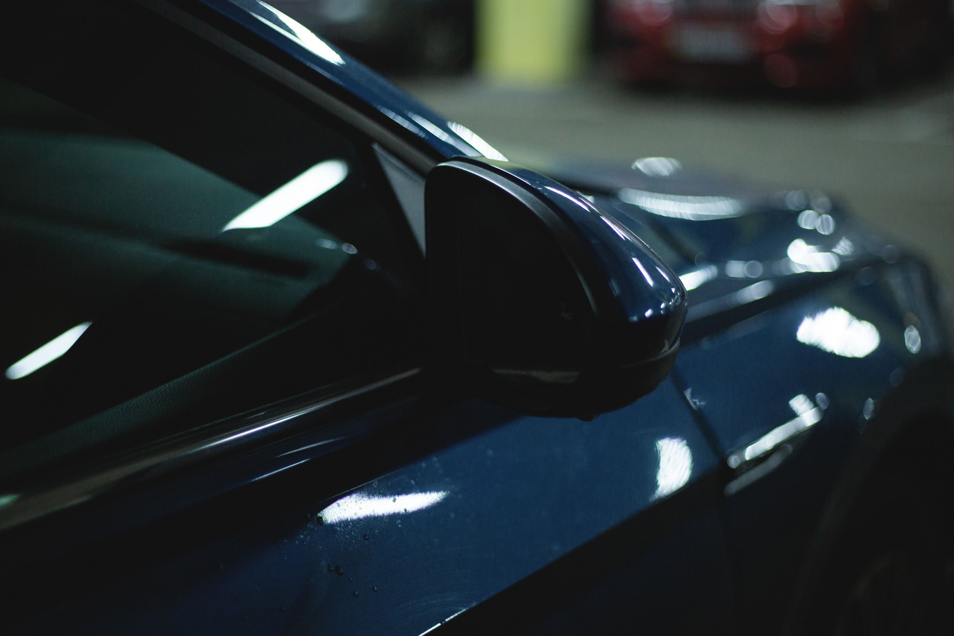 fragment of the front of a modern blue car